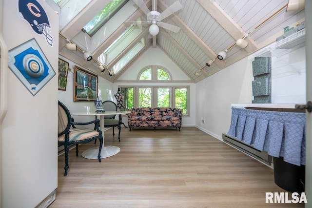 408 W Ravinwoods Rd, Peoria, IL 61615 - living room with a skylight, ceiling fan, beamed ceiling, high vaulted ceiling, and wood finished floors
