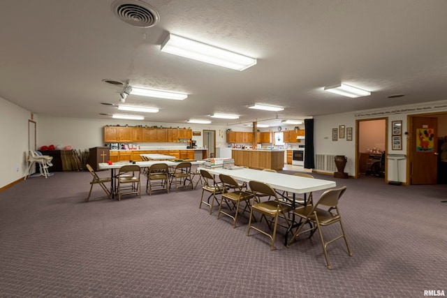 dining room with dark carpet