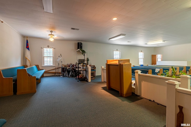 misc room with dark colored carpet