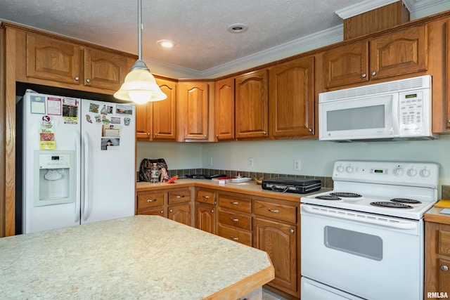 kitchen with white appliances, decorative light fixtures, a textured ceiling, and crown molding