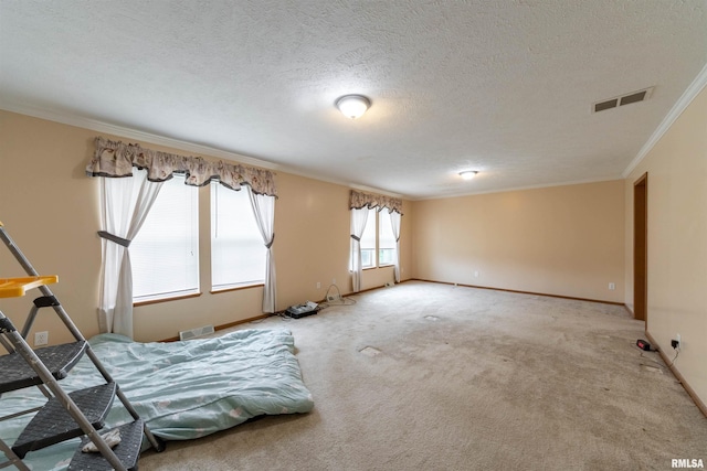 unfurnished room featuring light carpet, ornamental molding, and a textured ceiling