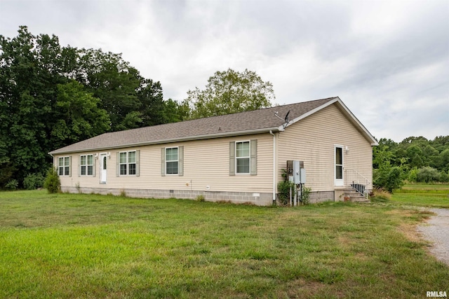 back of property with a yard