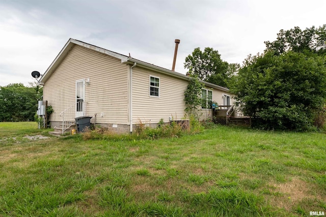 view of home's exterior featuring a yard