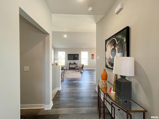 hall with dark hardwood / wood-style floors