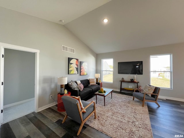 living room featuring dark hardwood / wood-style flooring and lofted ceiling