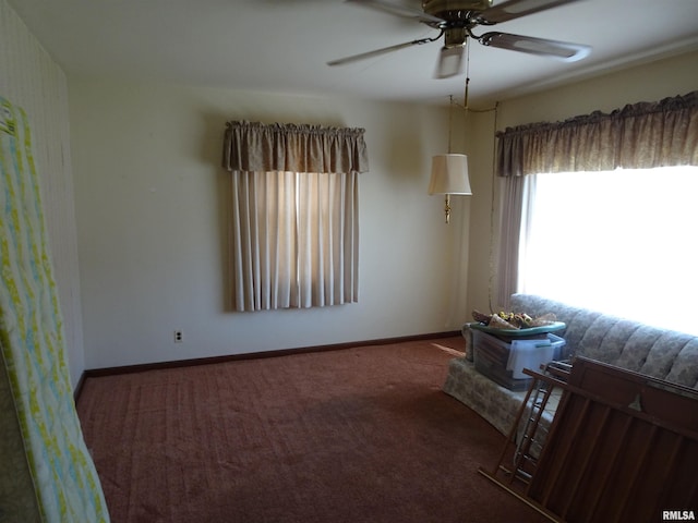 carpeted empty room with ceiling fan