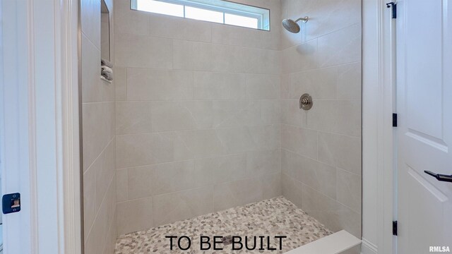 bathroom featuring tiled shower