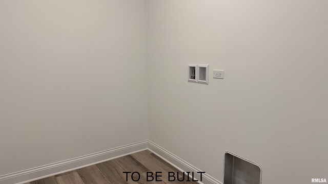 laundry room with laundry area, hookup for a washing machine, baseboards, and dark wood-type flooring