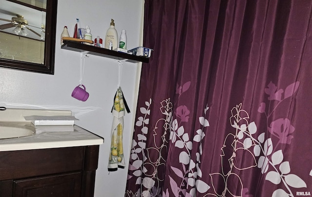 bathroom featuring ceiling fan and vanity