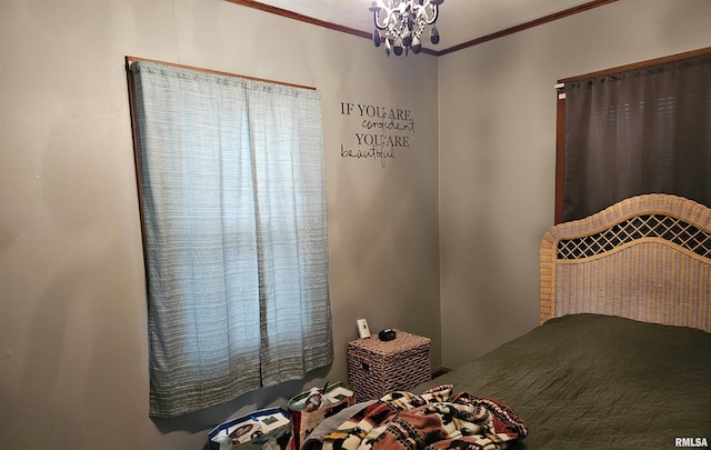 bedroom with a chandelier and ornamental molding