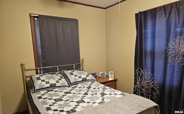 bedroom with ornamental molding