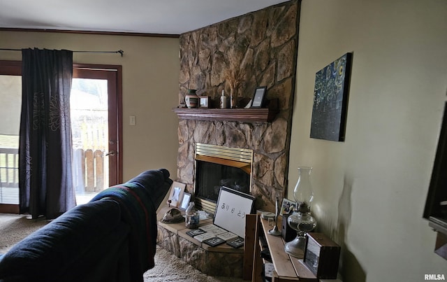 living room with a fireplace and dark carpet