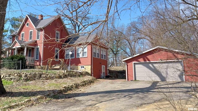 view of front of home with covered porch and a garage