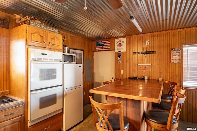 kitchen featuring ceiling fan, white appliances, and wooden ceiling