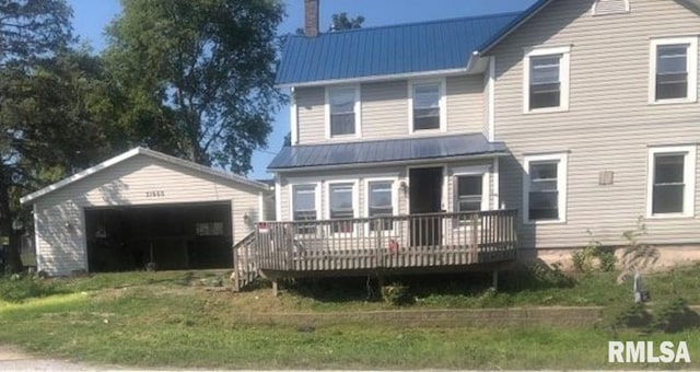 view of front of home with a front yard and a wooden deck