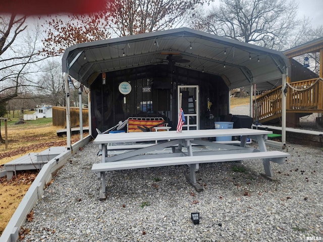 back of house featuring a deck