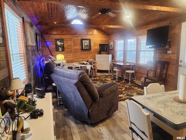 living room with vaulted ceiling, wood-type flooring, wooden walls, and wooden ceiling