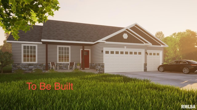 view of front facade with a garage and a front lawn