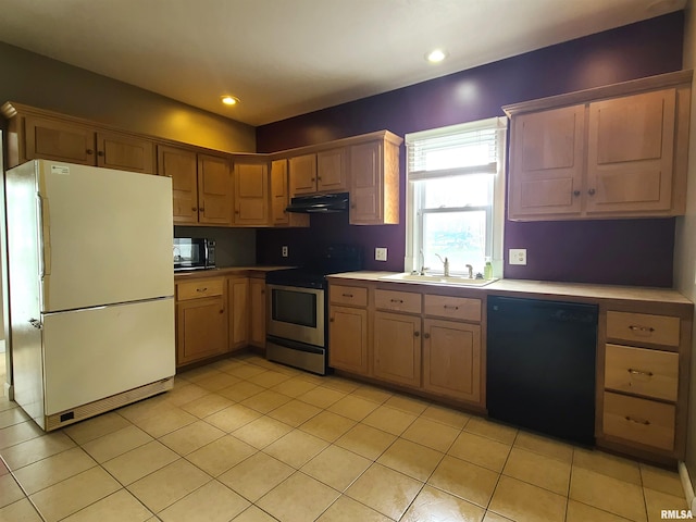 kitchen featuring black appliances, sink, and light tile patterned floors