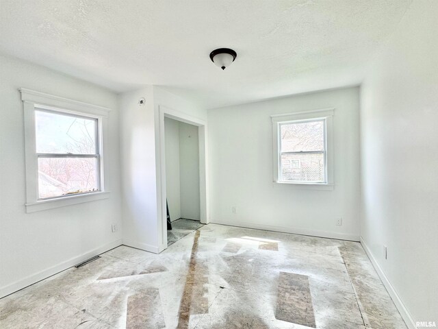 unfurnished bedroom featuring a textured ceiling