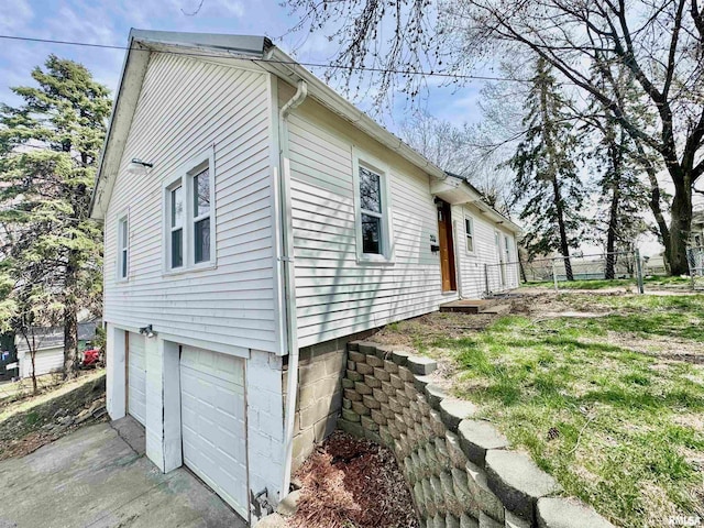 view of property exterior featuring a garage