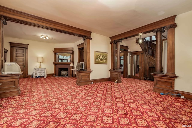 unfurnished living room with ornate columns