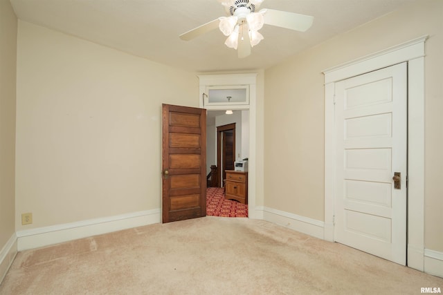 unfurnished bedroom with carpet flooring and ceiling fan