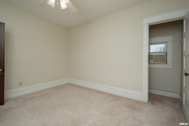 empty room featuring ceiling fan and carpet flooring