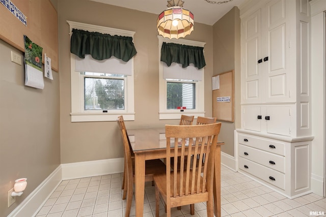 dining area with light tile floors