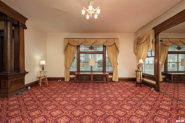 unfurnished room with an inviting chandelier