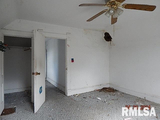 interior space featuring a ceiling fan