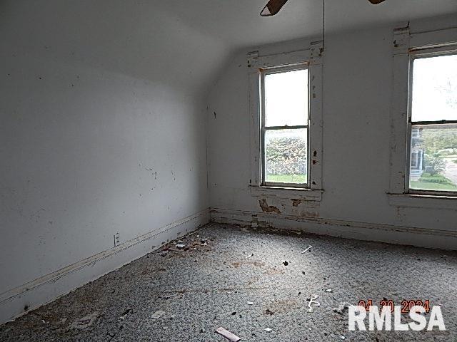 bonus room with lofted ceiling and ceiling fan