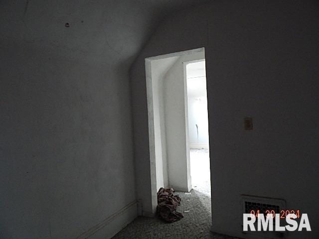 interior space featuring vaulted ceiling