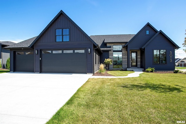 modern farmhouse with a front yard and a garage