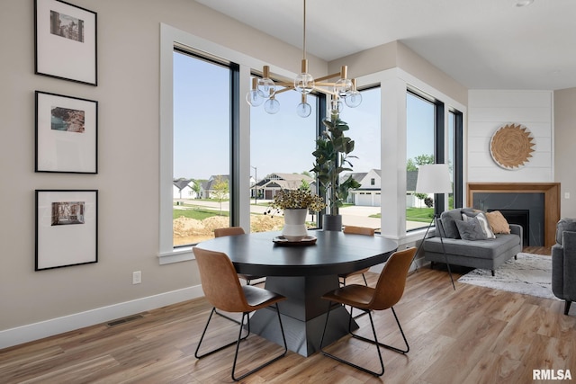 dining area featuring hardwood / wood-style flooring and a wealth of natural light