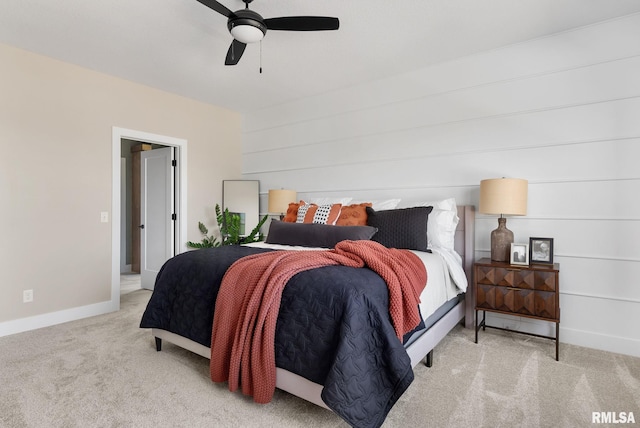 bedroom featuring ceiling fan and light carpet