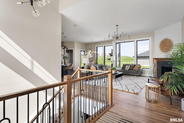 interior space featuring hardwood / wood-style flooring and an inviting chandelier