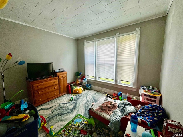 bedroom featuring ornamental molding