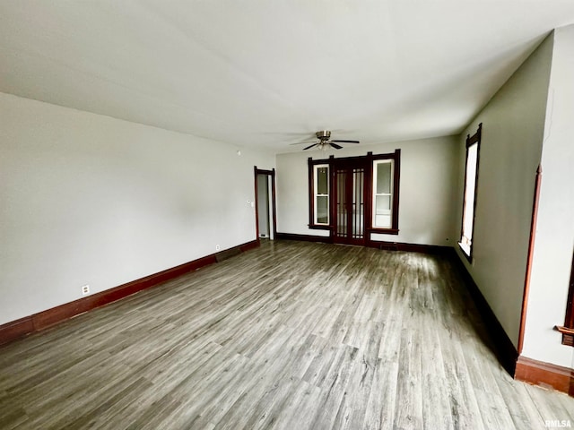 unfurnished room featuring wood-type flooring and ceiling fan