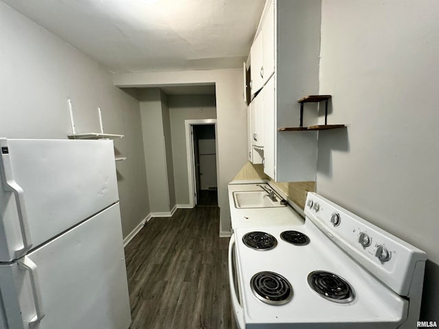 kitchen featuring dark hardwood / wood-style flooring, white fridge, stove, white cabinets, and sink