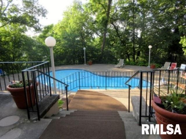 view of swimming pool featuring a patio