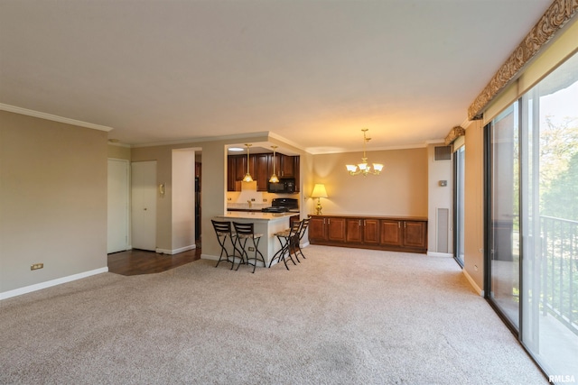 interior space with a notable chandelier, plenty of natural light, and crown molding