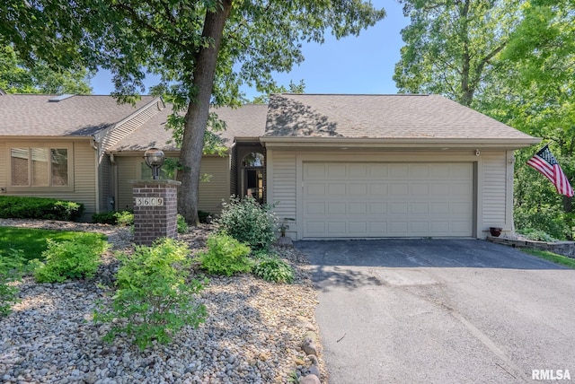 ranch-style home with a garage