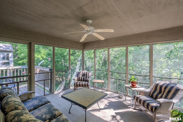 sunroom with a wealth of natural light and ceiling fan