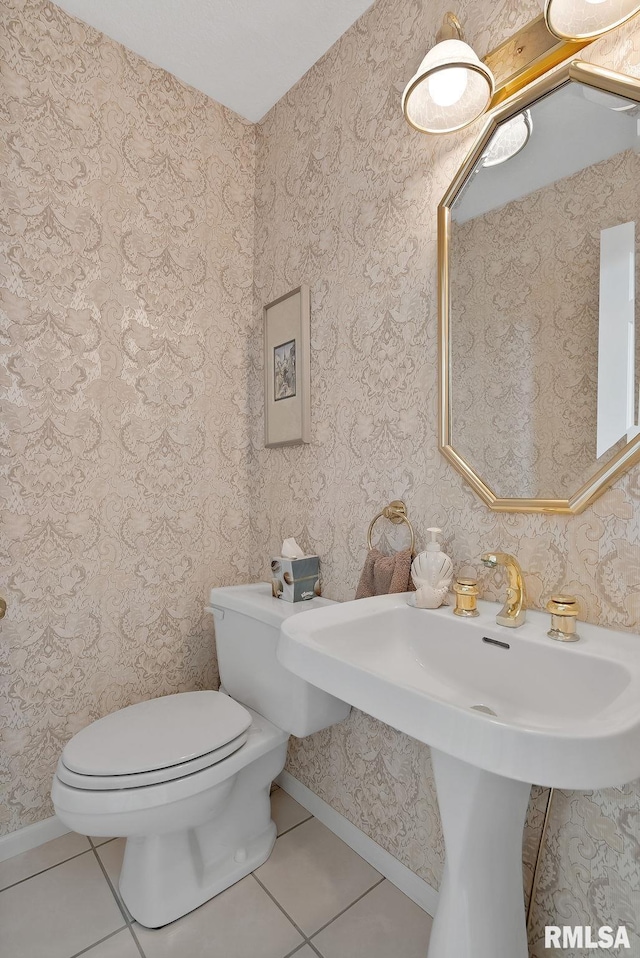 bathroom with tile patterned flooring and toilet