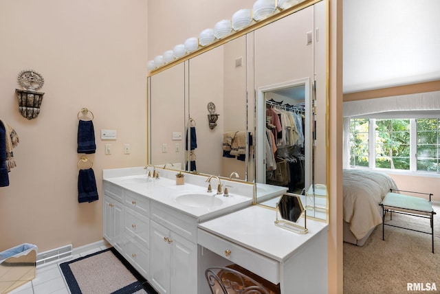 bathroom with vanity and tile patterned floors