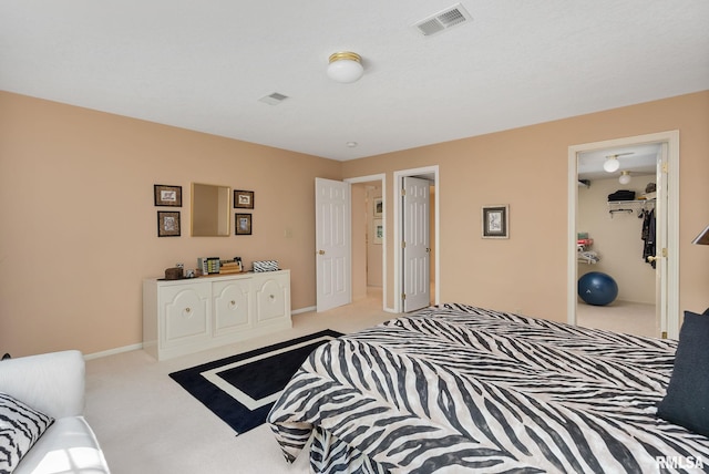 bedroom featuring light colored carpet