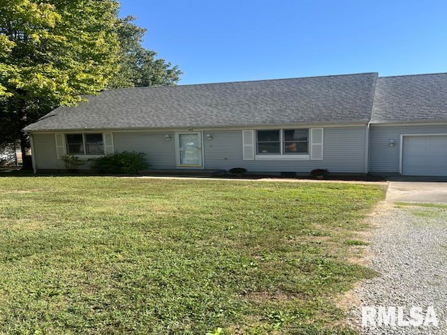 single story home featuring a garage and a front lawn