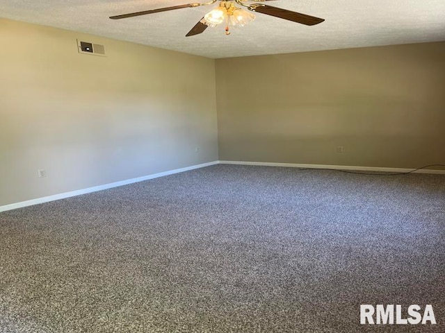 carpeted spare room with ceiling fan and a textured ceiling