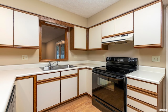 kitchen with white cabinets, sink, black electric range, a textured ceiling, and light wood-type flooring